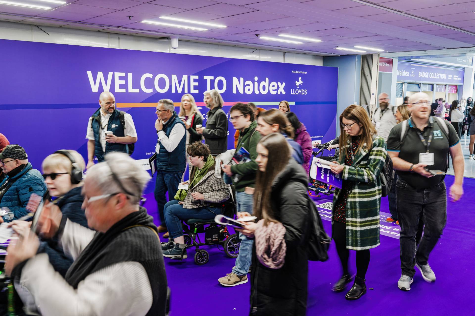 Crowd seat at Naidex engaged and smiling